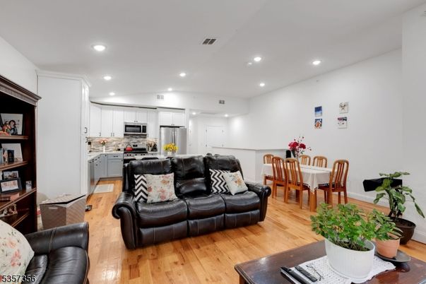 Dining room, Interior, Kitchen, Living room, Recessed Lighting, Stainless Steel Appliances, Wood Texture Flooring