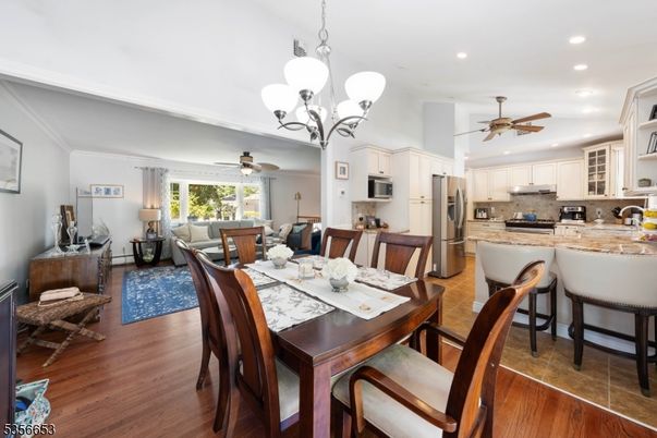 Chandelier, Dining room, Interior, Kitchen, Living room, Recessed Lighting, Stainless Steel Appliances, Wood Texture Flooring