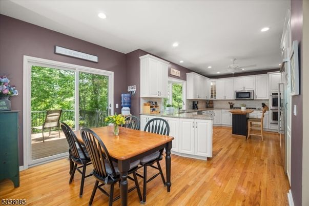 Dining room, Interior, Kitchen, Recessed Lighting, Stainless Steel Appliances, Wood Texture Flooring