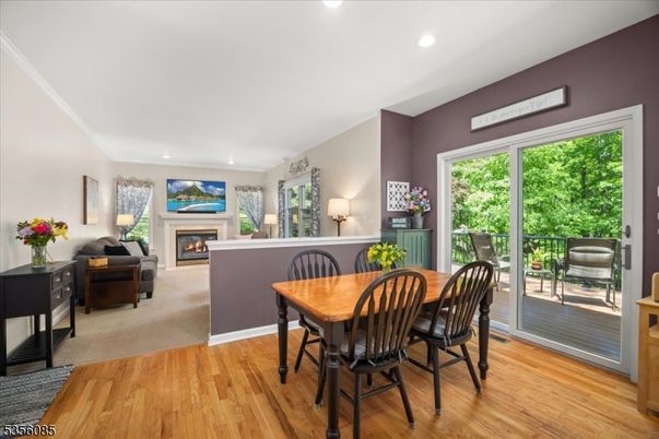 Dining room, Fireplace, Interior, Living room, Recessed Lighting, Wood Texture Flooring