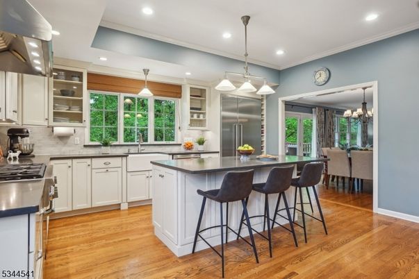Chandelier, Dining room, Interior, Kitchen, Pendant Lights, Recessed Lighting, Stainless Steel Appliances, Wood Texture Flooring