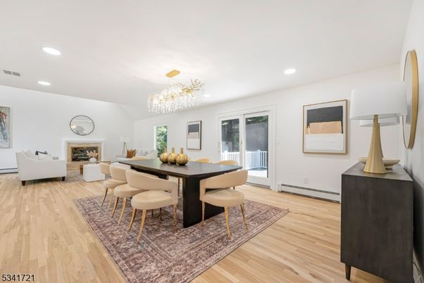 Chandelier, Dining room, Fireplace, Interior, Living room, Recessed Lighting, Wood Texture Flooring