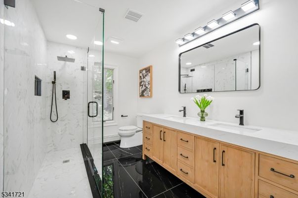 Bathroom, Dual Sink Vanities, Glass Shower, Interior, Marble, Marble Walls, Recessed Lighting