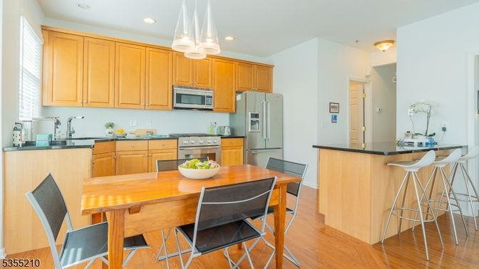 Dining room, Interior, Kitchen, Pendant Lights, Recessed Lighting, Stainless Steel Appliances, Wood Texture Flooring