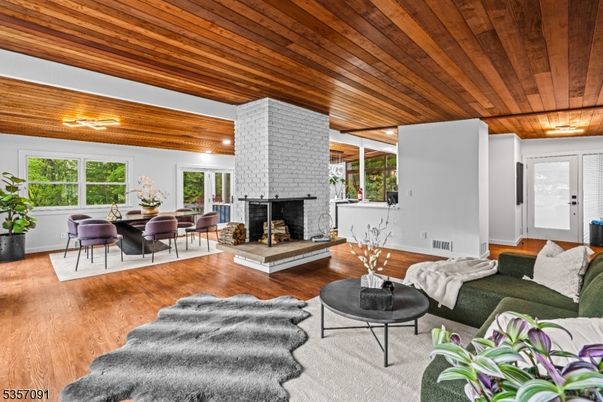Dining room, Fireplace, Interior, Living room, Stone Walls, Wooden Ceilings, Wood Texture Flooring