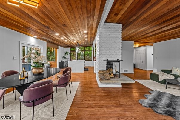 Dining room, Fireplace, Interior, Recessed Lighting, Stone Walls, Wooden Ceilings, Wood Texture Flooring