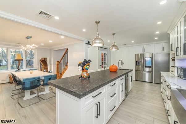Dining room, Interior, Kitchen, Pendant Lights, Recessed Lighting, Stainless Steel Appliances, Wood Texture Flooring