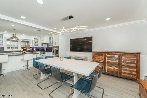 Dining room, Interior, Kitchen, Pendant Lights, Recessed Lighting, Stainless Steel Appliances, Wood Texture Flooring