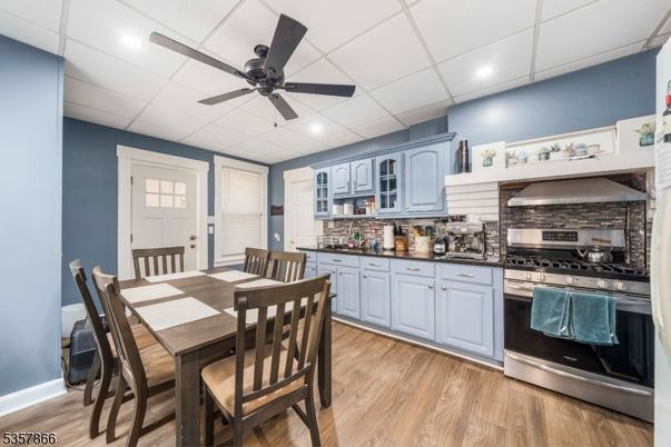 Dining room, Interior, Kitchen, Recessed Lighting, Stainless Steel Appliances, Wood Texture Flooring