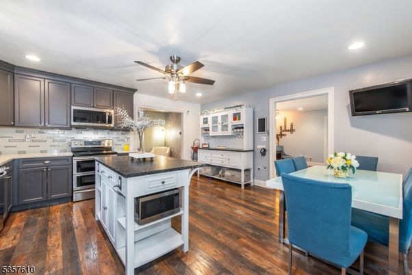 Dining room, Interior, Kitchen, Recessed Lighting, Stainless Steel Appliances, Wood Texture Flooring