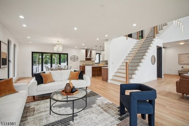 Chandelier, Dining room, Interior, Kitchen, Living room, Pendant Lights, Recessed Lighting, Stainless Steel Appliances, Wood Texture Flooring