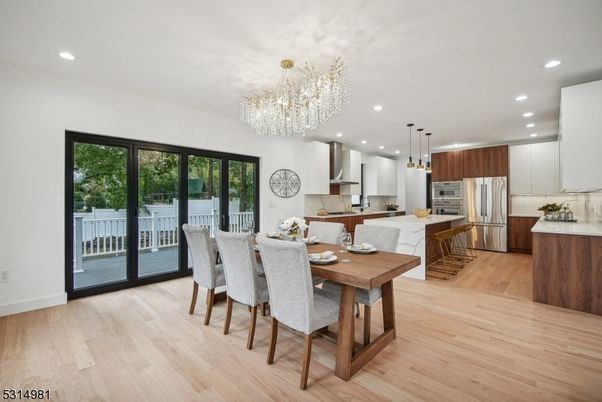 Chandelier, Dining room, Interior, Kitchen, Pendant Lights, Recessed Lighting, Stainless Steel Appliances, Wood Texture Flooring