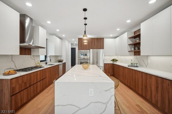 Interior, Kitchen, Marble Walls, Pendant Lights, Recessed Lighting, Stainless Steel Appliances, Wood Texture Flooring