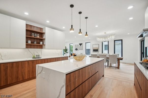 Chandelier, Dining room, Interior, Kitchen, Pendant Lights, Recessed Lighting, Stainless Steel Appliances, Wood Texture Flooring