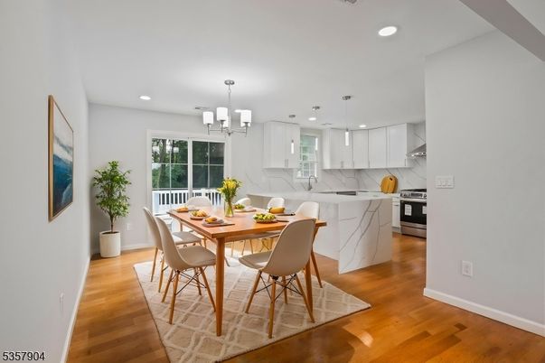 Dining room, Interior, Kitchen, Pendant Lights, Recessed Lighting, Stainless Steel Appliances, Wood Texture Flooring