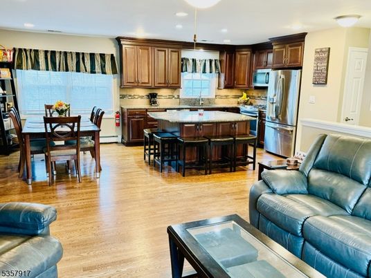Dining room, Interior, Kitchen, Pendant Lights, Recessed Lighting, Stainless Steel Appliances, Wood Texture Flooring