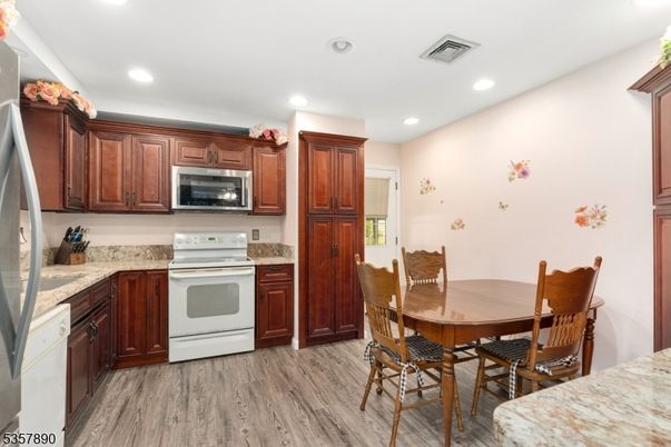 Dining room, Interior, Kitchen, Recessed Lighting, Stainless Steel Appliances, Wood Texture Flooring