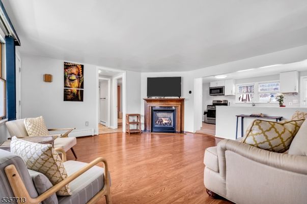 Fireplace, Interior, Kitchen, Living room, Stainless Steel Appliances, Wood Texture Flooring