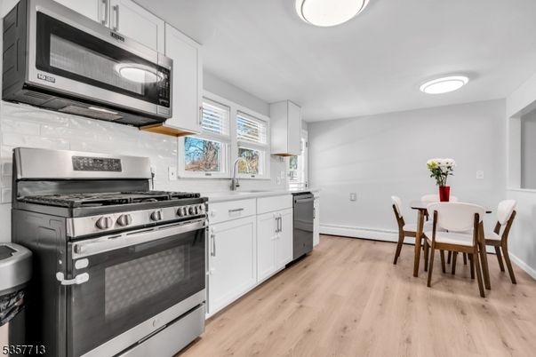 Dining room, Interior, Kitchen, Stainless Steel Appliances, Wood Texture Flooring