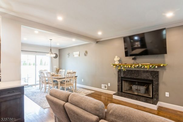 Dining room, Fireplace, Interior, Pendant Lights, Recessed Lighting, Wood Texture Flooring