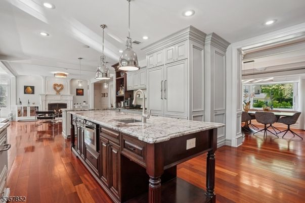 Dining room, Fireplace, Interior, Kitchen, Living room, Pendant Lights, Recessed Lighting, Stainless Steel Appliances, Wood Texture Flooring