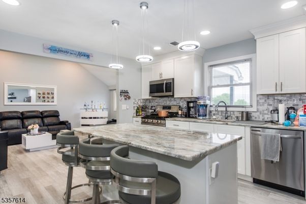 Interior, Kitchen, Living room, Pendant Lights, Recessed Lighting, Stainless Steel Appliances, Wood Texture Flooring