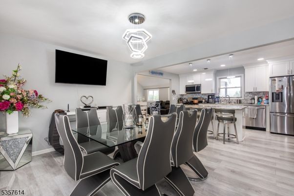 Dining room, Interior, Kitchen, Pendant Lights, Recessed Lighting, Stainless Steel Appliances, Wood Texture Flooring