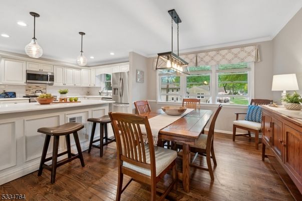 Dining room, Interior, Kitchen, Pendant Lights, Recessed Lighting, Stainless Steel Appliances, Wood Texture Flooring