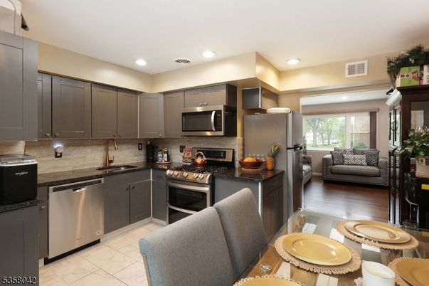 Dining room, Interior, Kitchen, Marble, Recessed Lighting, Stainless Steel Appliances, Wood Texture Flooring