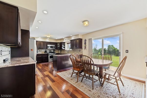 Dining room, Interior, Kitchen, Recessed Lighting, Stainless Steel Appliances, Wood Texture Flooring