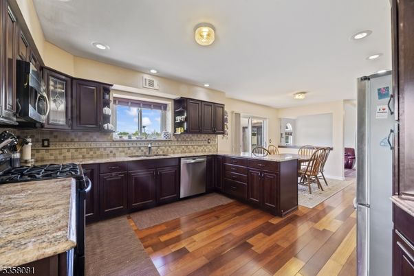 Dining room, Interior, Kitchen, Recessed Lighting, Stainless Steel Appliances, Wood Texture Flooring