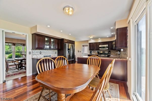 Dining room, Interior, Kitchen, Recessed Lighting, Stainless Steel Appliances, Wood Texture Flooring