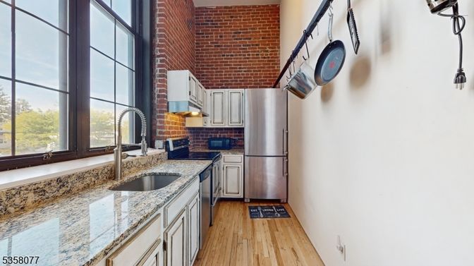 Interior, Kitchen, Stainless Steel Appliances, Stone Walls, Wood Texture Flooring