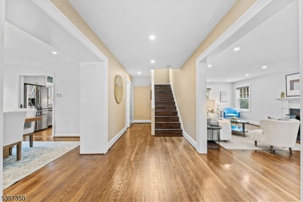 Fireplace, Interior, Kitchen, Living room, Recessed Lighting, Stainless Steel Appliances, Wood Texture Flooring