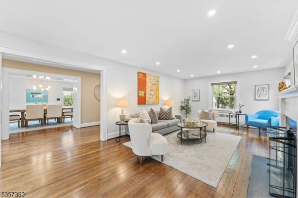 Dining room, Fireplace, Interior, Living room, Pendant Lights, Recessed Lighting, Wood Texture Flooring
