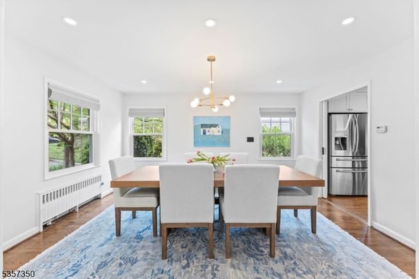Dining room, Interior, Kitchen, Pendant Lights, Recessed Lighting, Stainless Steel Appliances, Wood Texture Flooring