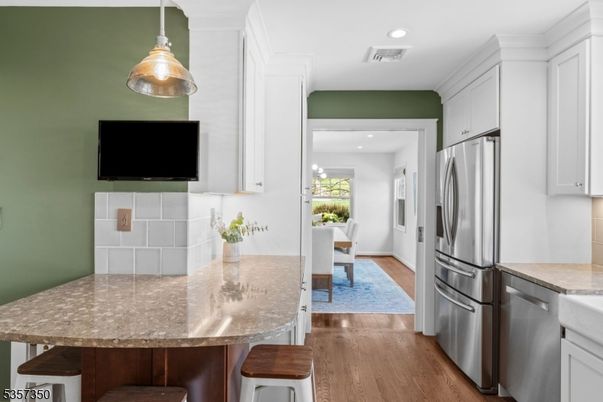 Dining room, Interior, Kitchen, Pendant Lights, Recessed Lighting, Stainless Steel Appliances, Wood Texture Flooring