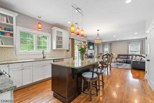 Dining room, Fireplace, Interior, Kitchen, Living room, Pendant Lights, Recessed Lighting, Stainless Steel Appliances, Wood Texture Flooring