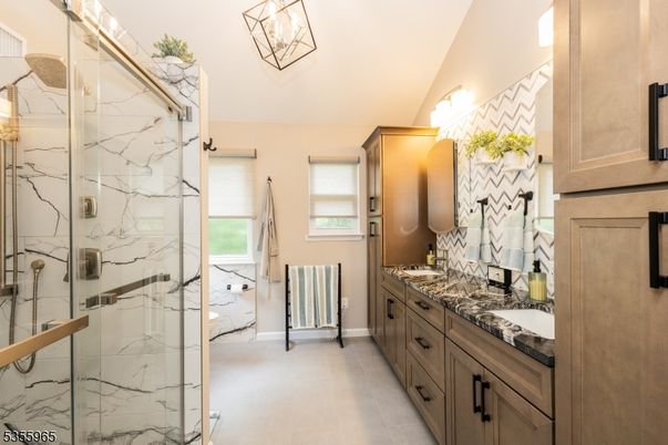 Bathroom, Dual Sink Vanities, Glass Shower, Interior, Marble Walls, Pendant Lights