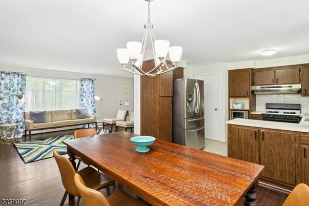 Chandelier, Dining room, Interior, Kitchen, Living room, Stainless Steel Appliances, Wood Texture Flooring