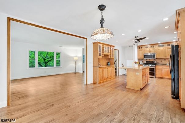 Chandelier, Interior, Kitchen, Pendant Lights, Recessed Lighting, Stainless Steel Appliances, Wood Texture Flooring