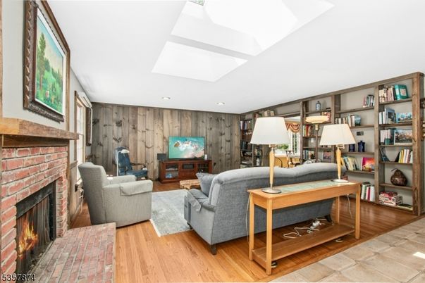 Fireplace, Interior, Living room, Recessed Lighting, Wood Texture Flooring, Wooden Walls