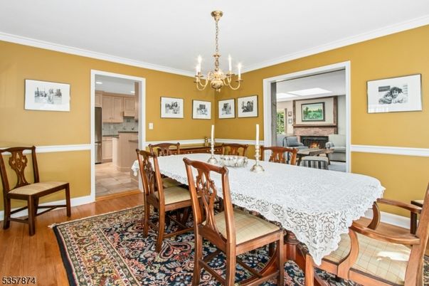 Chandelier, Dining room, Fireplace, Interior, Kitchen, Wood Texture Flooring