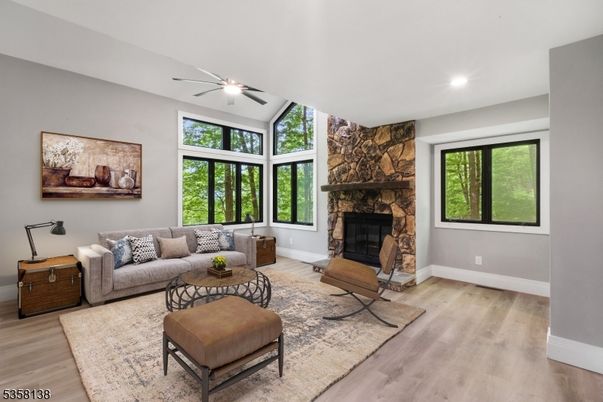 Fireplace, Interior, Living room, Recessed Lighting, Stone Walls, Wood Texture Flooring
