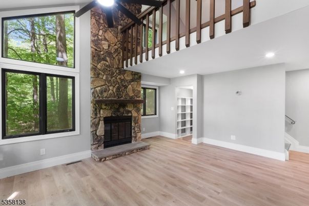 Fireplace, Interior, Recessed Lighting, Stone Walls, Wood Texture Flooring
