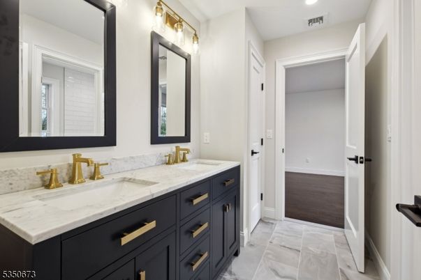 Bathroom, Dual Sink Vanities, Interior, Marble, Recessed Lighting, Wood Texture Flooring