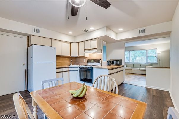 Dining room, Interior, Kitchen, Recessed Lighting, Tile Countertops, Wood Texture Flooring