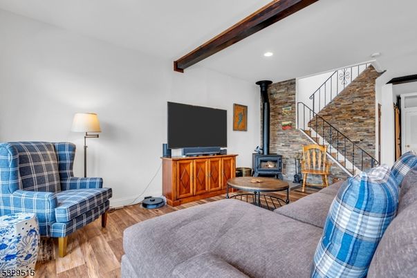Fireplace, Interior, Living room, Recessed Lighting, Stone Walls, Wooden Beams, Wood Texture Flooring