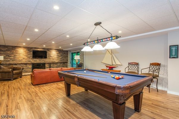 Billiard Table, Game Room, Interior, Pendant Lights, Recessed Lighting, Stone Walls, Wood Texture Flooring