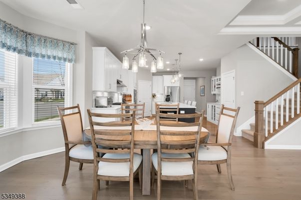 Dining room, Interior, Kitchen, Pendant Lights, Recessed Lighting, Stainless Steel Appliances, Wood Texture Flooring